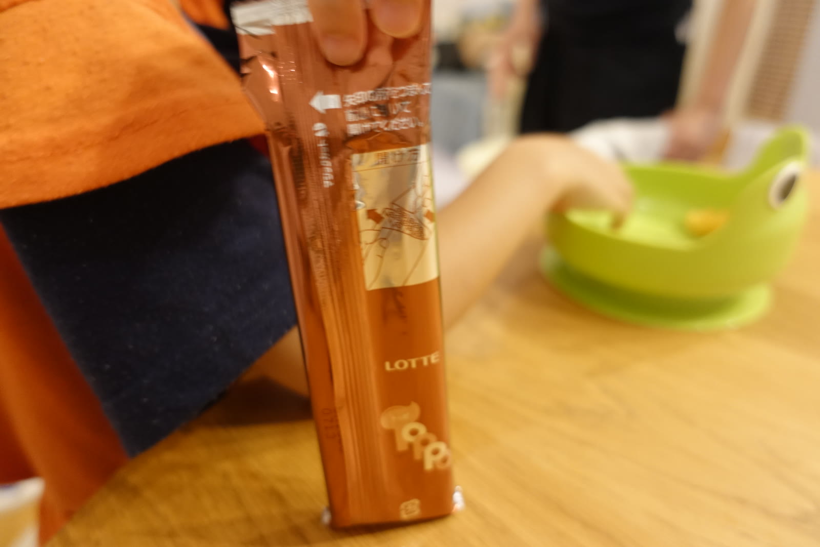Sticks half out of the wrapper.